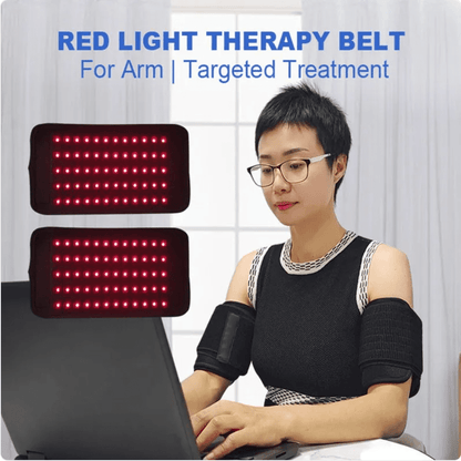 A woman wearing a red light therapy arm band on her left arm and a matching band on her right arm sits at a desk using a laptop. Two inset graphics on the left show the rectangular red LED light therapy panels.
