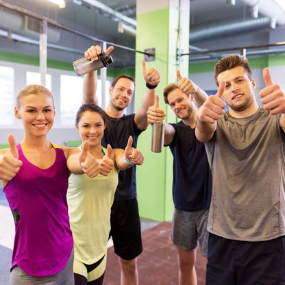 Group of people in a gym giving thumbs up